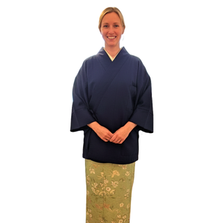 Woman wearing a navy Chore Jacket Sewing Pattern styled after a traditional Japanese Samue jacket.