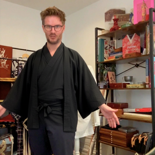 Japanese Sewing Pattern model wearing a black kimono in a craft studio.