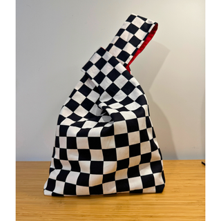 Japanese Knot Bag Pattern in a stylish black and white checkered design, perfect for sewing enthusiasts.