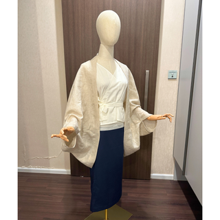 Cape Jacket Sewing Pattern displayed on a mannequin, showcasing elegant layering and chic design.