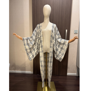 Image of a stylish Kimono Coat Sewing Pattern made from plaid fabric, showcasing a beginner-friendly design.