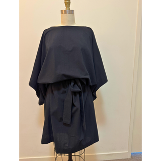 Kimono Dress Sewing Pattern displayed on a mannequin, featuring wide sleeves and a tie waist in a dark fabric.