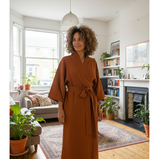 Model wearing a kimono jacket, showcasing the Kimono Jacket Sewing Pattern in a cozy home environment.