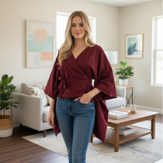 Model wearing a stylish Kimono Wrap Top Sewing Pattern in burgundy, showcasing kimono sleeves and adjustable wrap design.