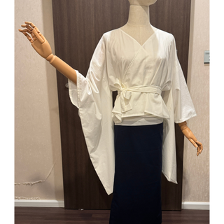 Kimono Wrap Top Sewing Pattern displayed on a mannequin, featuring wide kimono sleeves and adjustable wrap design.