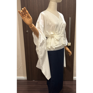 Kimono Wrap Top Sewing Pattern displayed on a mannequin, showcasing wide kimono sleeves and adjustable wrap design.