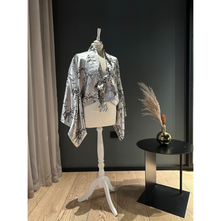 Kimono Jacket Sewing Pattern showcased on a mannequin, displaying its elegant design with floral patterns.