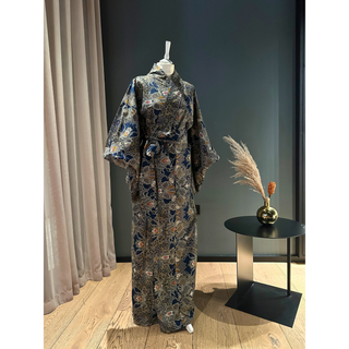 Elegant full view of a women's yukata sewing pattern displayed on a mannequin against a stylish backdrop.