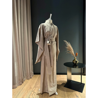 Model wearing a beige Kimono Jacket Sewing Pattern, showcasing traditional Japanese design with modern styling.